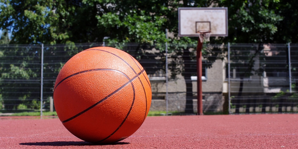 bigstock-outdoors-basketball-court-with-228631498